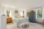 First floor bedroom with a queen bed and plenty of storage